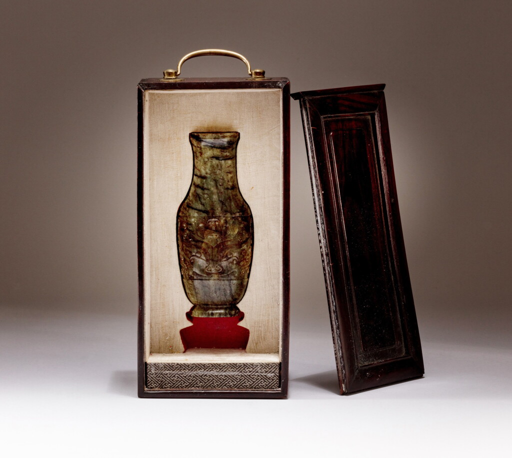 View full screen - View 1 of Lot 110. A mottled grey jade archaistic vase, Qing dynasty, 18th - 19th century | 清十八至十九世紀 灰白玉仿古瓶.
