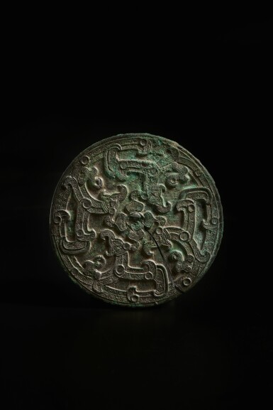 View full screen - View 1 of Lot 251. A rare bronze ‘four dragons’ mirror, Eastern Zhou dynasty, Warring States period | 東周 戰國 銅龍紋鏡.