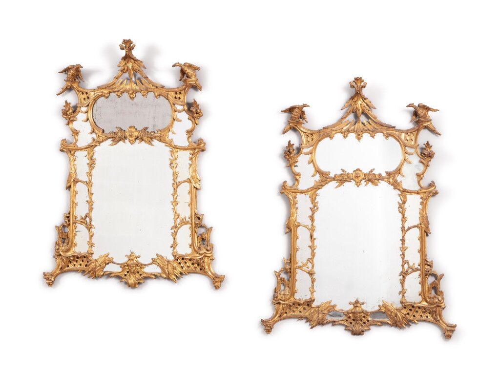 View full screen - View 1 of Lot 39. A pair of giltwood and carved mirrors, Chippendale style, late 19th century | Paire de miroirs à parecloses en bois doré et sculpté de style Chippendale, fin du XIXeme siècle.