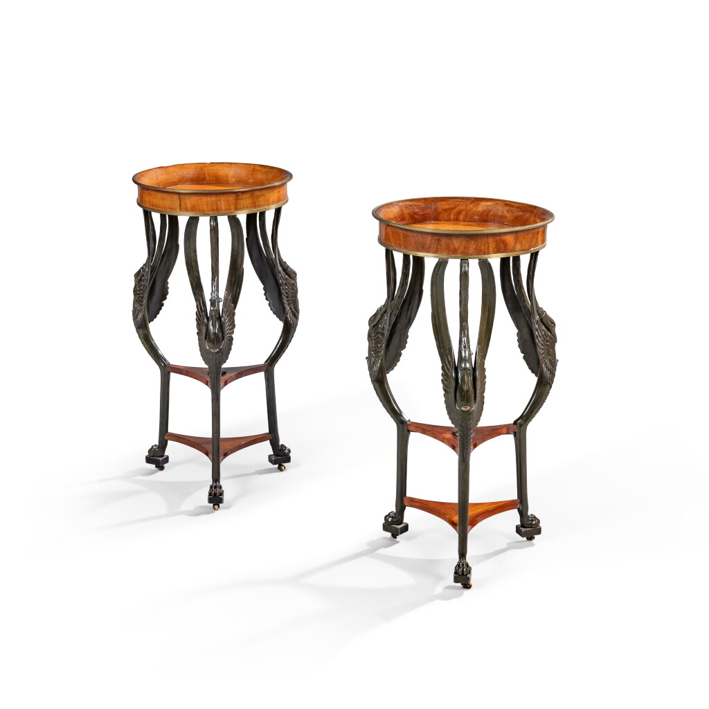 View full screen - View 1 of Lot 230. A pair of Consulate gilt-bronze mounted plum pudding mahogany, mahogany veneered and painted wood imitating bronze guéridons, circa 1800.