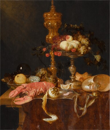 View full screen - View 1 of Lot 324. A still life with a lobster, a gilt cup, a tazza, a shell, a Wan-Li bowl and a clock, together with a lemon, grapes, peaches and cherries.