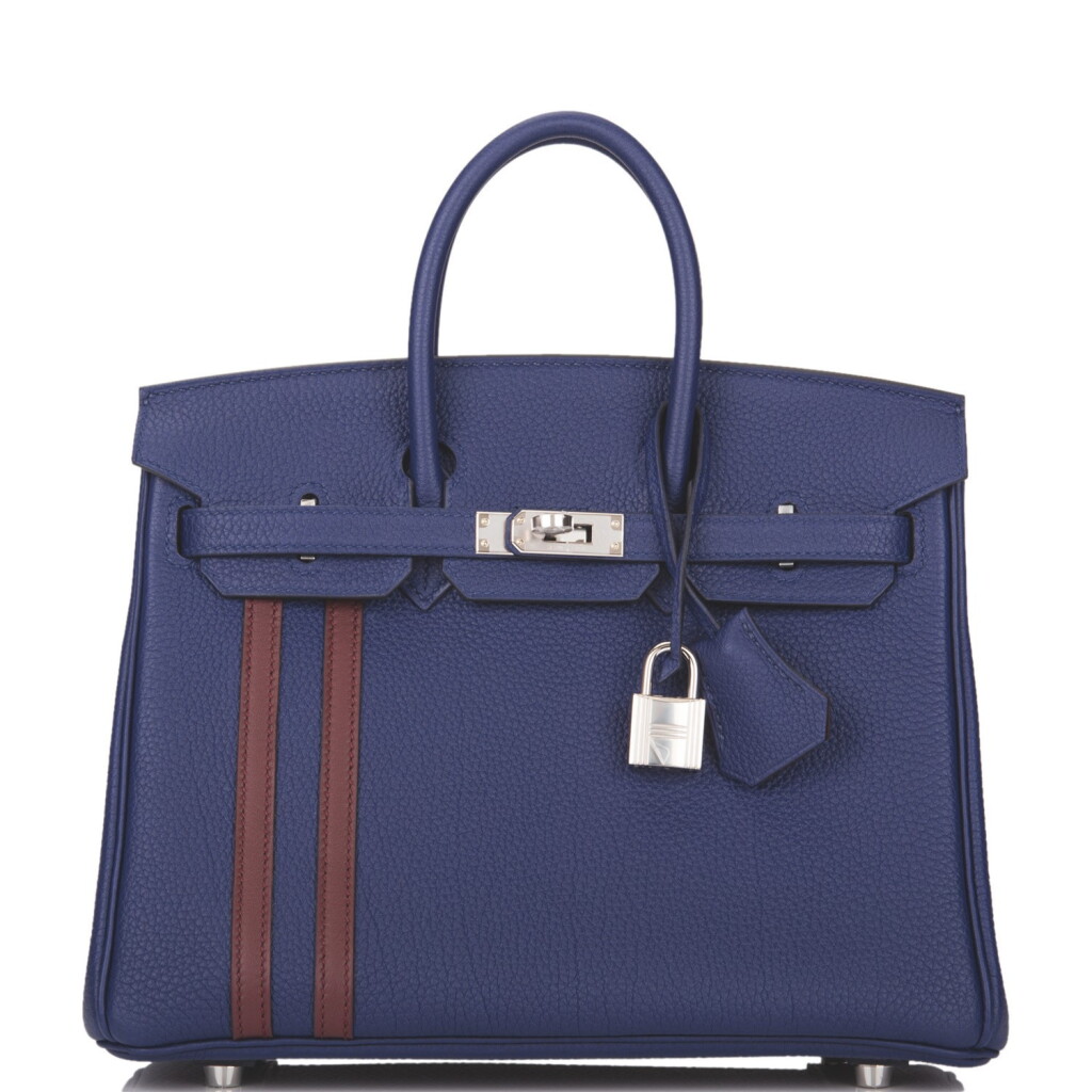 View full screen - View 1 of Lot 24. Hermès Bleu Encre and Bordeaux Officier Birkin 25cm of Togo Leather with Palladium Hardware.