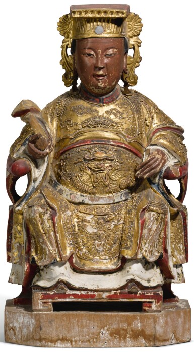 View full screen - View 1 of Lot 21. A gilt and lacquered wood figure of a dignitary, Qing dynasty, 19th century | 清十九世紀 漆金木神仙坐像.
