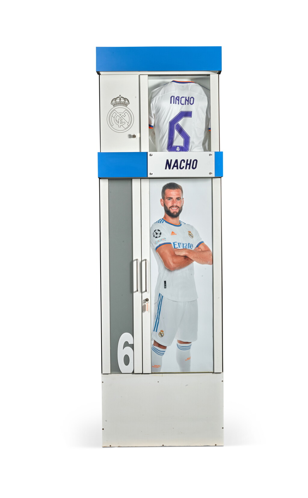 View full screen - View 1 of Lot 7. First Team Locker #6: The Real Madrid Santiago Bernabéu Stadium 2001/02 - 2021/22 | Nacho Fernández, Sami Khedira, Emmanuel Adebayor, Lassana Diarra, Mahamadou Diarra, Iván Helguera.