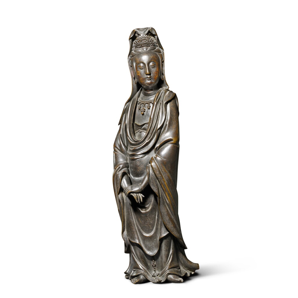 View full screen - View 1 of Lot 8912. An inscribed bronze figure of Guanyin, Qing dynasty, 17th - 18th century | 清十七至十八世紀 銅觀音菩薩立像 《心宇印》款.