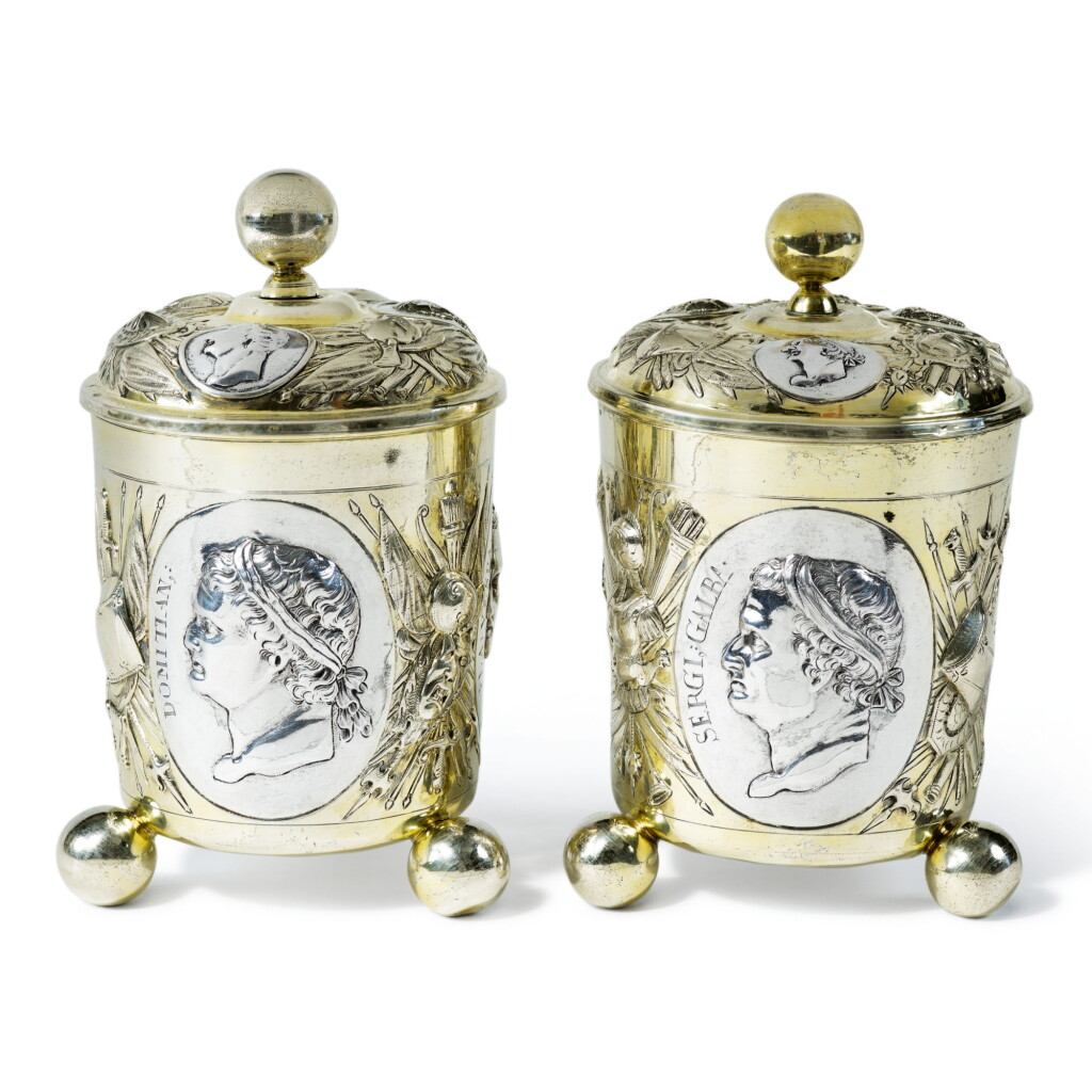 View full screen - View 1 of Lot 82. TWO MATCHING LARGE GERMAN PARCEL-GILT SILVER COVERED BEAKERS, JOHANN WAGNER, AUGSBURG, CIRCA 1700.