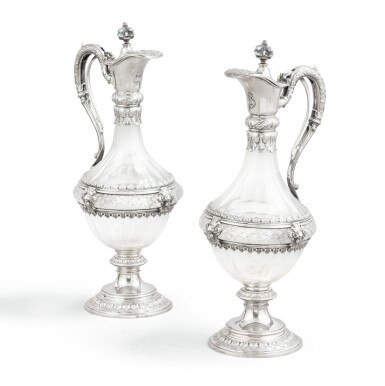 View full screen - View 1 of Lot 44. A pair of German cut-crystal silver-mounted decanters, 20th century | Paire d'aiguières couvertes en cristal monté en argent, Allemagne, XXe siècle.