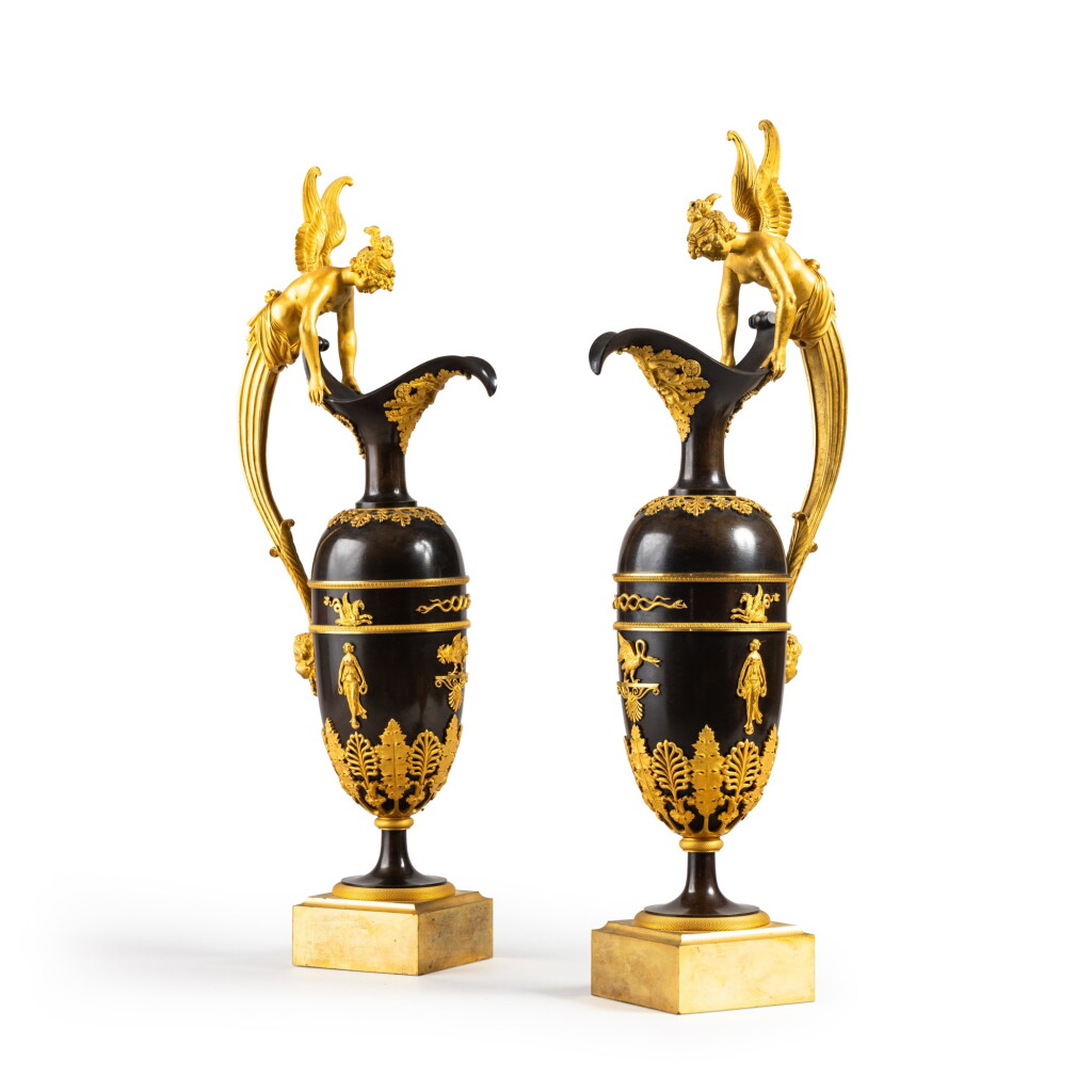 View full screen - View 1 of Lot 1. A pair of Empire gilt and patinated bronze ewers, circa 1810, attributed to Claude Galle.