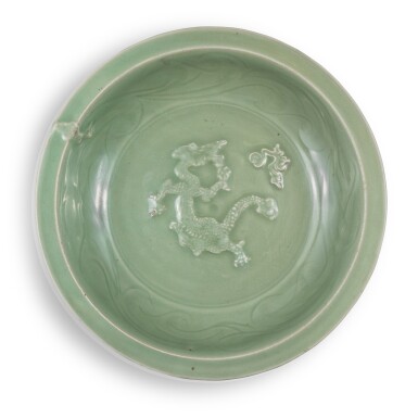 View full screen - View 1 of Lot 6. A molded and carved 'Longquan' celadon-glazed 'dragon' dish, Yuan dynasty.