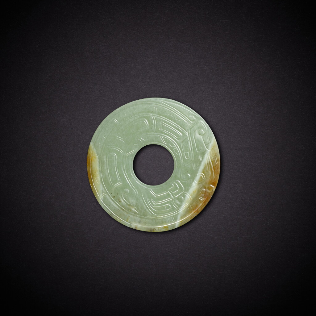 View full screen - View 1 of Lot 6827. A celadon jade 'dragon' disc, bi, Western Zhou dynasty | 西周 青玉龍紋璧.