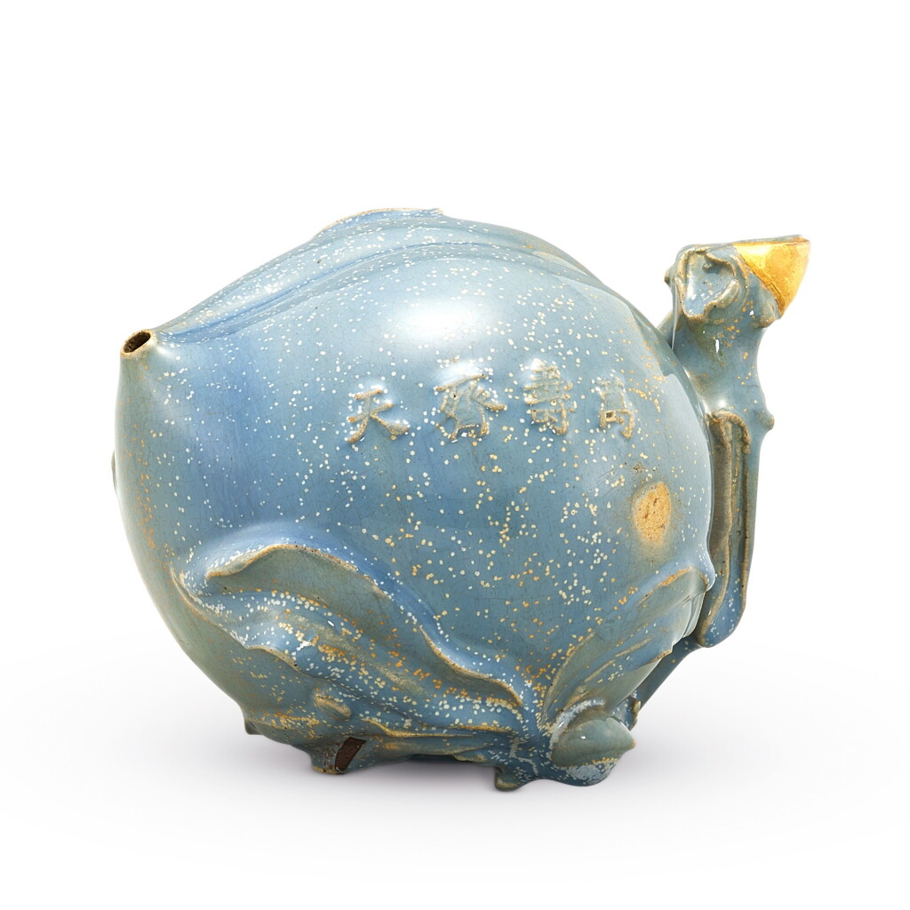 View full screen - View 1 of Lot 108. AN EXTREMELY RARE INSCRIBED YIXING JUN-IMITATION 'PEACH' WATERDROPPER QING DYNASTY, YONGZHENG PERIOD | 清雍正 紫砂宜鈞釉「萬壽齊天」桃形水注.