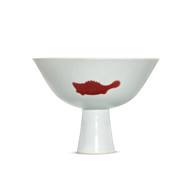 View full screen - View 1 of Lot 380. A Ming-style copper-red 'three fish' stem bowl, Mark and period of Yongzheng | 清雍正 釉裏紅三魚紋高足盌 《大清雍正年製》款.