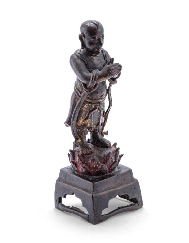 View full screen - View 1 of Lot 165. A bronze figure of a praying attendant Ming dynasty, 17th century | 明十七世紀 銅佛教人物立像.