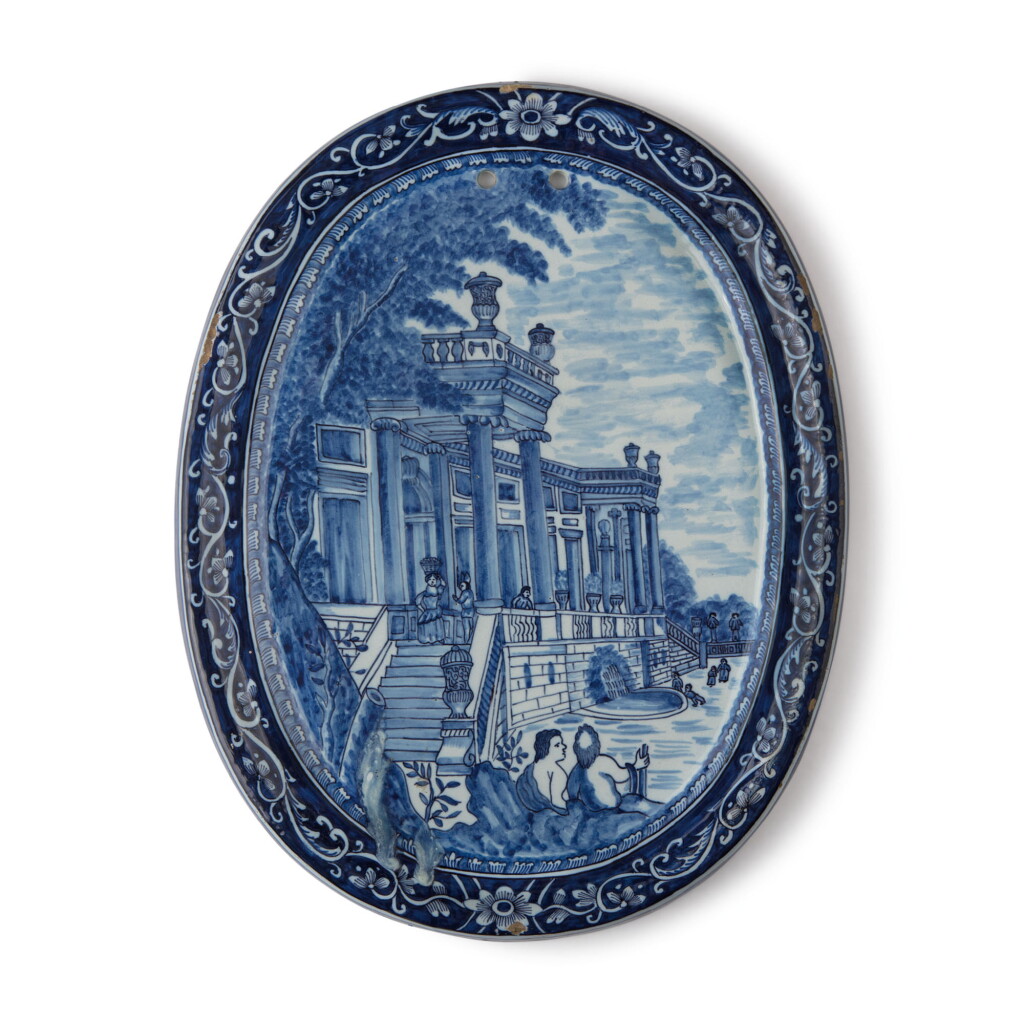View full screen - View 1 of Lot 543. A DUTCH DELFT BLUE AND WHITE SHAPED OVAL PLAQUE, EARLY 18TH CENTURY.