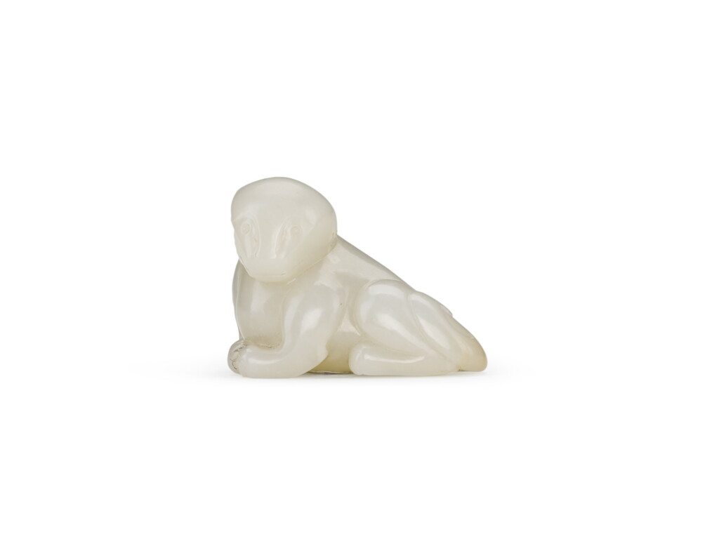 View full screen - View 1 of Lot 103. A white jade bear, Qing dynasty, 18th/19th century | 清十八/十九世紀 白玉臥熊.