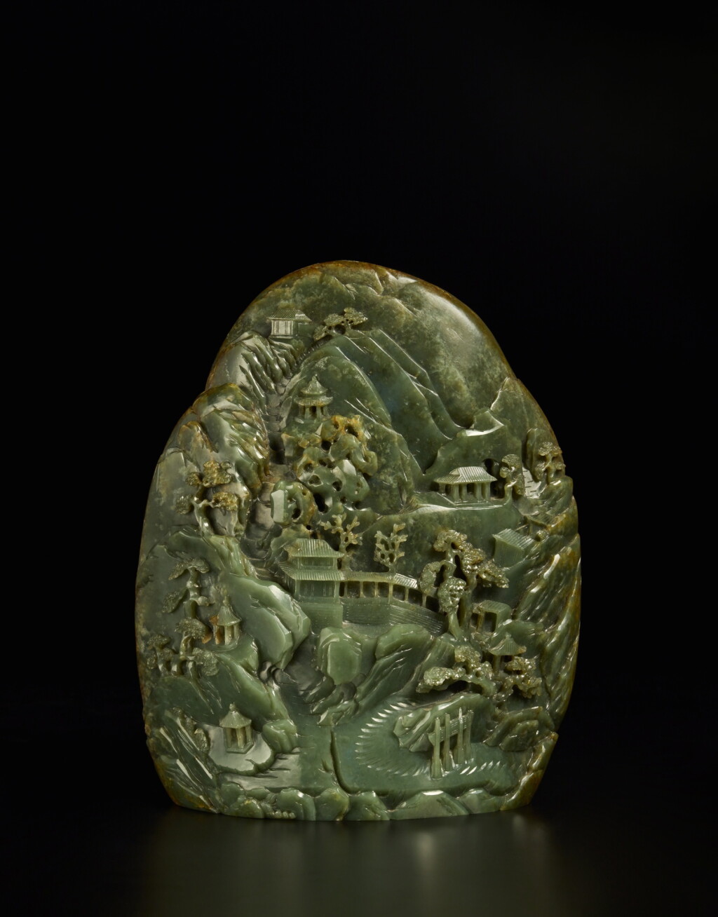 View full screen - View 1 of Lot 202. A large spinach-green jade 'mountain' boulder, Qing dynasty, Qianlong period.