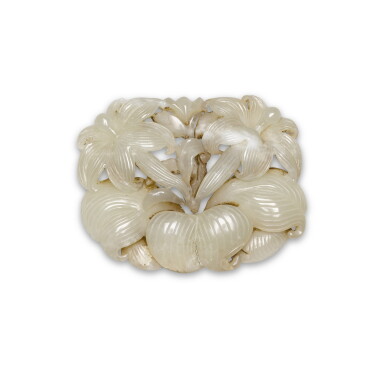 View full screen - View 1 of Lot 133. A pale celadon jade reticulated 'floral' plaque, Yuan dynasty | 元 青白玉鏤雕花卉紋珮.