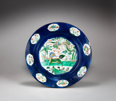 View full screen - View 1 of Lot 21. A large powder-blue famille-verte ‘qilin and phoenix’ dish, Qing dynasty, Kangxi period | 清康熙 五彩藍地瑞獸圖大盤.