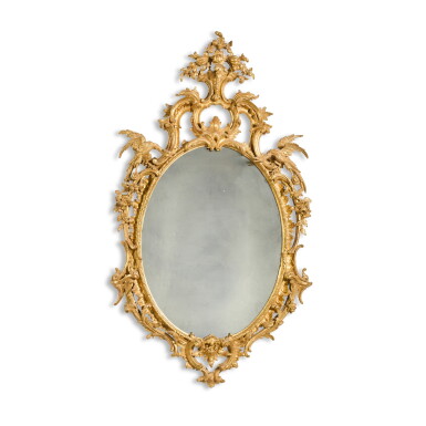 View full screen - View 1 of Lot 21. An early George III carved giltwood oval mirror, circa 1765.