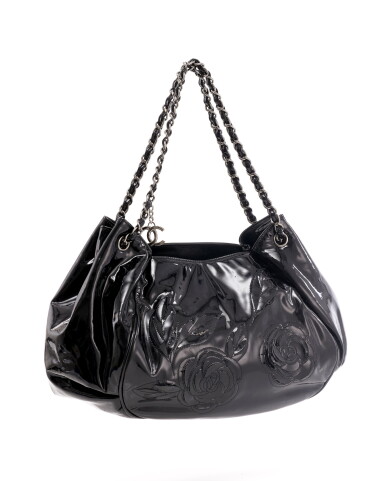 View full screen - View 1 of Lot 131. Shiny black vinyl and silver-tone metal shoulder bag.