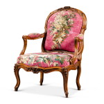 A Louis XV carved walnut "à chassis" armchair, circa 1760, stamped by Louis Delanois | Fauteuil à chassis en noyer sculpté d'époque Louis XV, vers 1760, estampille de Louis Delanois