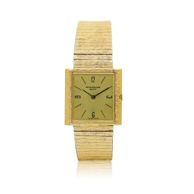 View full screen - View 1 of Lot 189. PATEK PHILIPPE | A YELLOW GOLD RECTANGULAR BRACELET WATCH, CIRCA 1970.