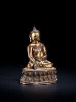 A gilt-copper alloy figure of Shakyamuni Buddha, Tibet, 14th century