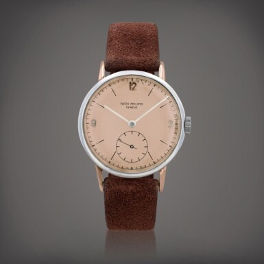 View full screen - View 1 of Lot 386. 'Oversized Calatrava', reference 1513/1 Montre bracelet en acier et or rose avec cadran saumon | Stainless steel and pink gold wristwatch with salmon dial Faite en 1949 | Made in 1949.