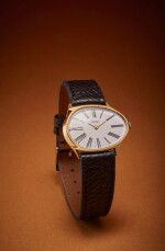 Poire | New York retailed: An unusual yellow gold asymmetric pear-shaped wristwatch with yellow gold deployant buckle, Circa 1965