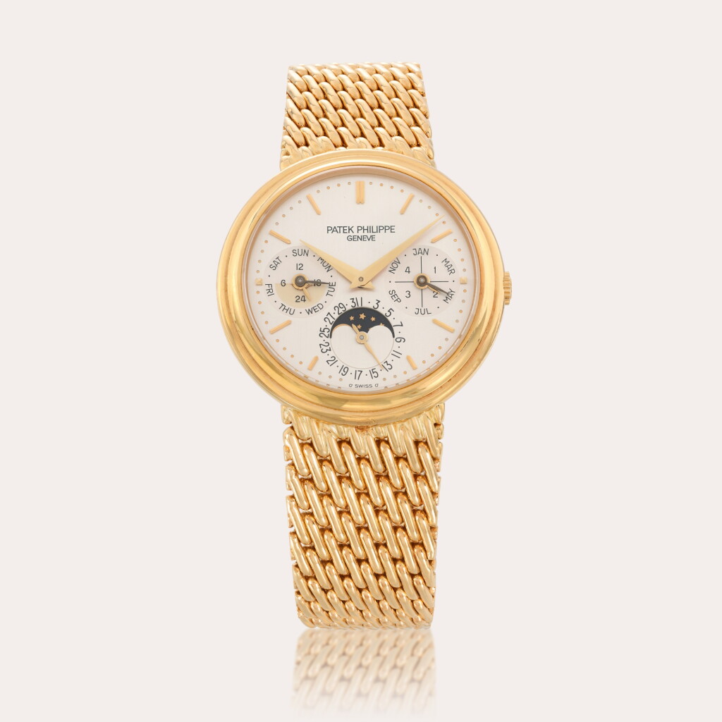 View full screen - View 1 of Lot 138. Reference 3945/1J | A yellow gold perpetual calendar bracelet watch with moon phases, leap year and 24-hour indication | Circa 1998.
