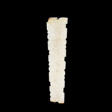 View full screen - View 1 of Lot 3616. A white and russet jade long pendant, Eastern Zhou dynasty, 5th century BC | 東周公元前五世紀 白玉變形龍紋珮.
