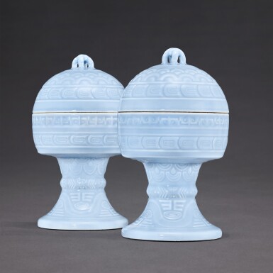 View full screen - View 1 of Lot 3516. A fine and rare pair of lavender-glazed altar vessels and covers, dou, Seal marks and period of Qianlong | 清乾隆 天藍釉淺浮雕蓋豆一對 《大清乾隆年製》款.
