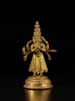A gilt-copper alloy figure of eleven-headed Avalokiteshvara, Tibet, early 15th century