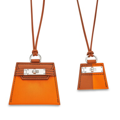 View full screen - View 1 of Lot 7904. Set of 2 Gold and Abricot Swift Monpetitkelly Pendants.