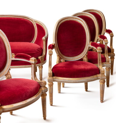 View full screen - View 1 of Lot 67. A late Louis XV white and gilt lacquered set of furniture "à chassis" attributed to Louis Delanois, circa 1770-1775 | Mobilier de salon à châssis en bois laqué blanc rechampi or attribué à Louis Delanois, de la fin de l'époque Louis XV, vers 1770-1775.
