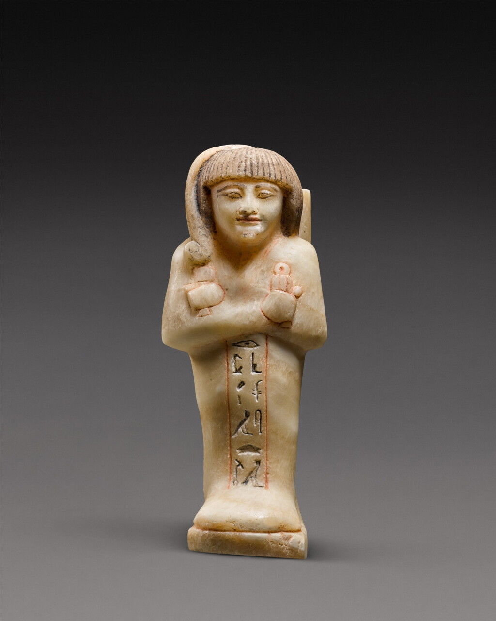 View full screen - View 1 of Lot 4. An Egyptian Polychrome Alabaster Votive Ushabti of Prince Khaemwaset, 19th Dynasty, reign of Ramesses II, 1279-1213 B.C..