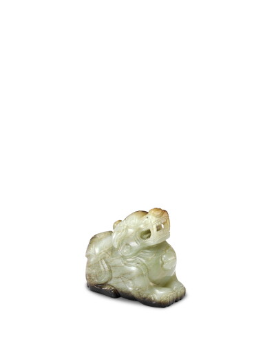 View full screen - View 1 of Lot 3907. A pale celadon and brown jade figure of a luduan, Ming dynasty or earlier | 明或更早 玉甪端.