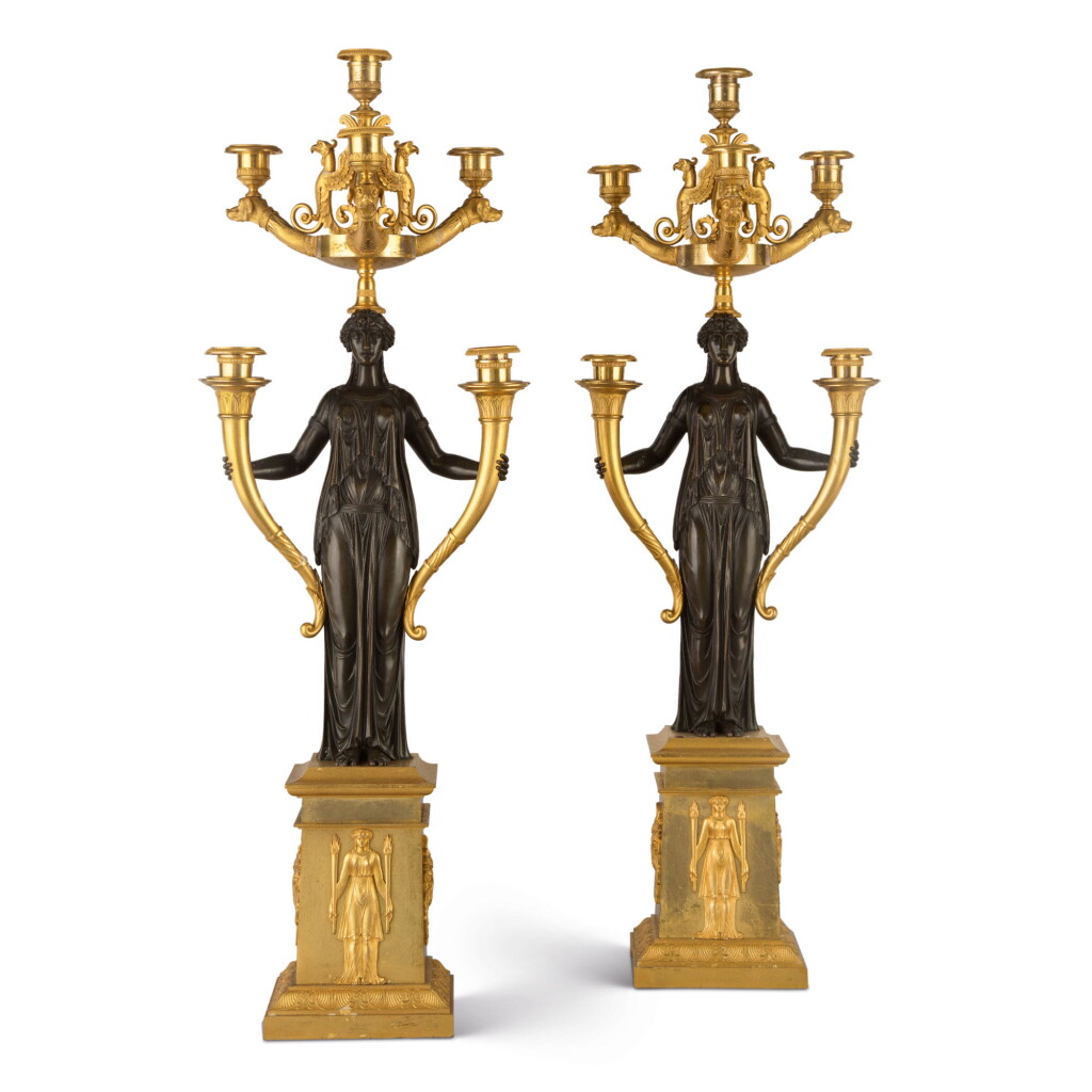 View full screen - View 1 of Lot 835. A PAIR OF EMPIRE STYLE GILT AND PATINATED BRONZE SIX-LIGHT CANDELABRA.