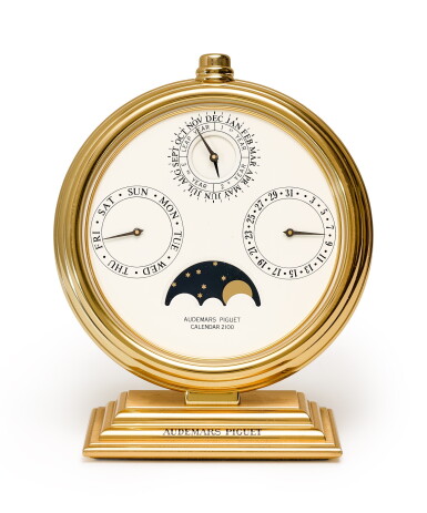 View full screen - View 1 of Lot 212. AUDEMARS PIGUET | CALENDAR 2100, A GILT BRASS PERPETUAL CALENDAR DISPLAY WITH MOON PHASES, CIRCA 1980.