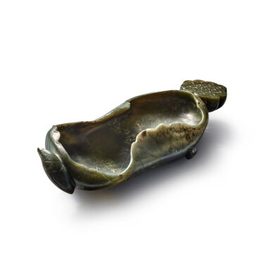 View full screen - View 1 of Lot 770. A large dark green jade 'lotus' washer, Qing dynasty, 19th / 20th century | 清十九 / 二十世紀 青玉雕荷葉形洗.