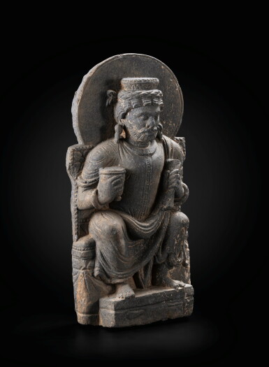 View full screen - View 1 of Lot 244. A grey schist figure of seated Indra Gandhara, 2nd-4th century | 犍陀羅 二至四世紀 灰片岩雕因陀羅坐像.
