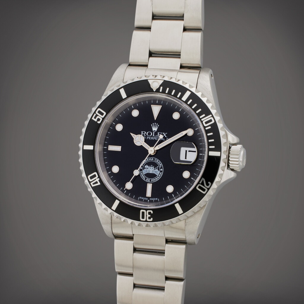 View full screen - View 1 of Lot 146. Reference 16610 Submariner ‘Panama Canal’ | A stainless steel automatic wristwatch with date and bracelet, made to commemorate the transfer of the canal from the United States to Panama, Circa 1999.