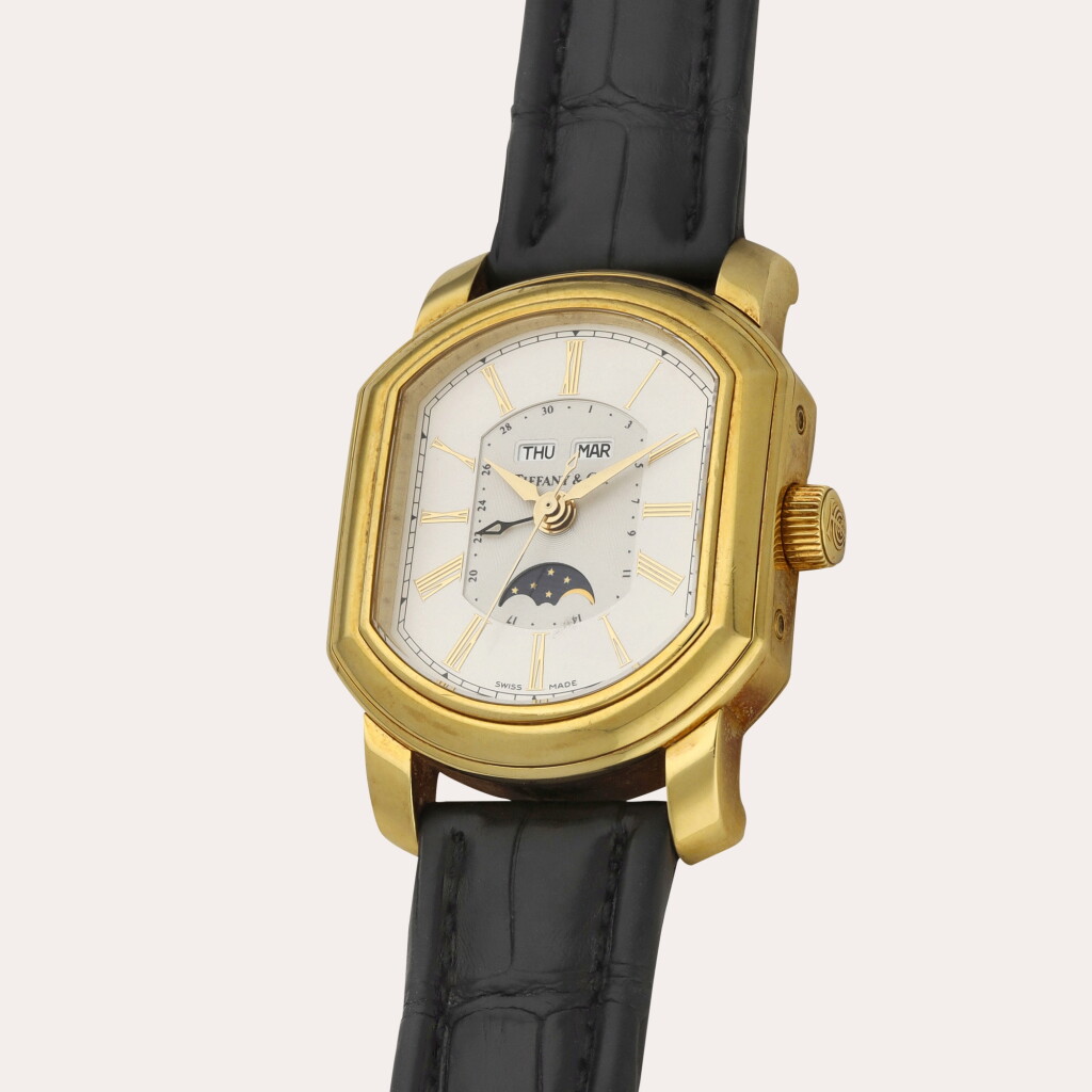 View full screen - View 1 of Lot 305. A yellow gold triple calendar wristwatch with moon phases | Circa 1990.