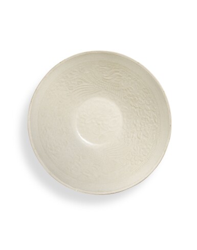 View full screen - View 1 of Lot 5029. A moulded Ding-type 'phoenix' bowl, Northern Song dynasty | 北宋 仿定窰白釉印鳳凰牡丹紋盌.