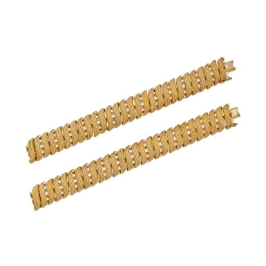 View full screen - View 1 of Lot 198. Pair of Gold and Diamond Bracelets.