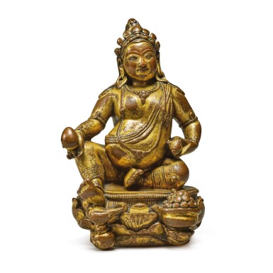 View full screen - View 1 of Lot 613. A GILT-BRONZE FIGURE OF JAMBHALA, 16TH / 17TH CENTURY.