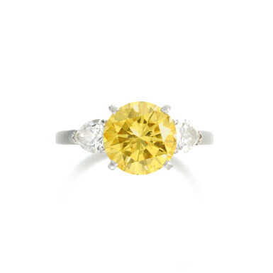View full screen - View 1 of Lot 825. Fancy Intense Yellow diamond ring.