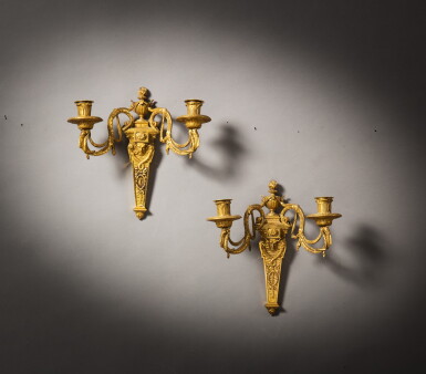 View full screen - View 1 of Lot 39. A pair of gilt-bronze two-light wall lights, possibly Austria, late 18th century | Paire d'appliques à deux lumières en bronze doré, travail étranger, probablement Autriche, fin du XVIIIe siècle.