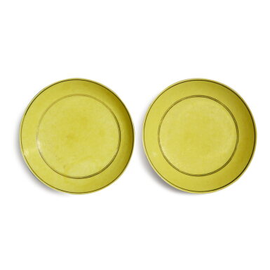 View full screen - View 1 of Lot 751. A pair of incised yellow-glazed 'dragon' dishes, Marks and period of Guangxu | 清光緒 黃釉暗刻雙龍戲珠紋盤一對 《大清光緒年製》款.