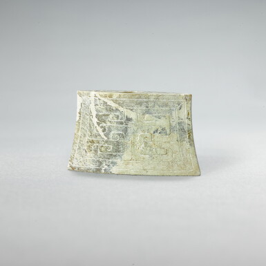 View full screen - View 1 of Lot 742. A celadon jade 'mask' scabbard chape, Western Han dynasty | 西漢 青玉獸面紋劍珌.